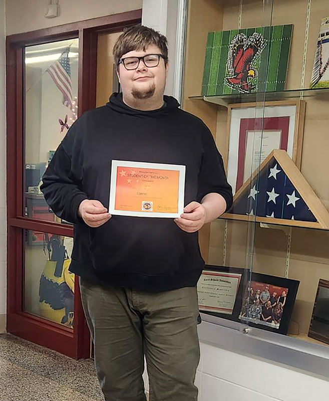 Connor Moore with his May Student of the Month certificate.