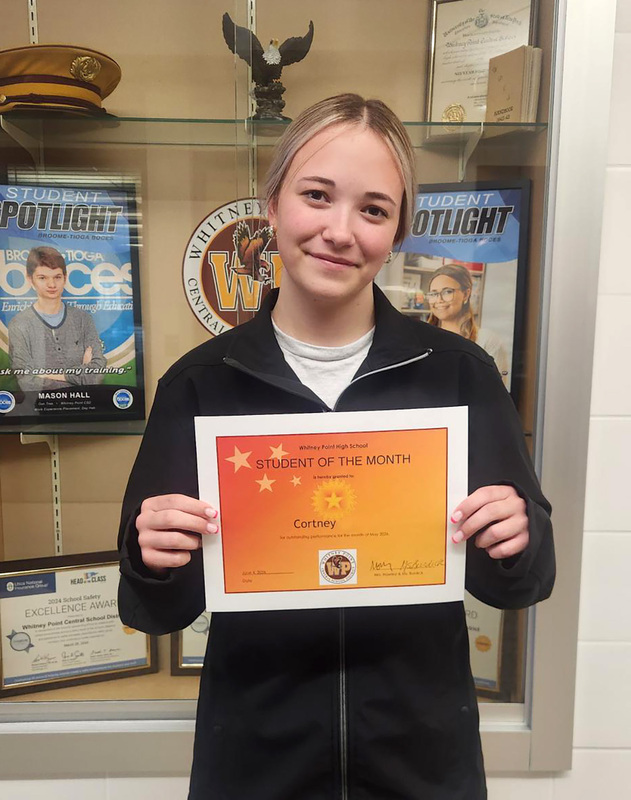 Whitney Point High School junior Cortney Murrer with her May Student of the Month certificate.