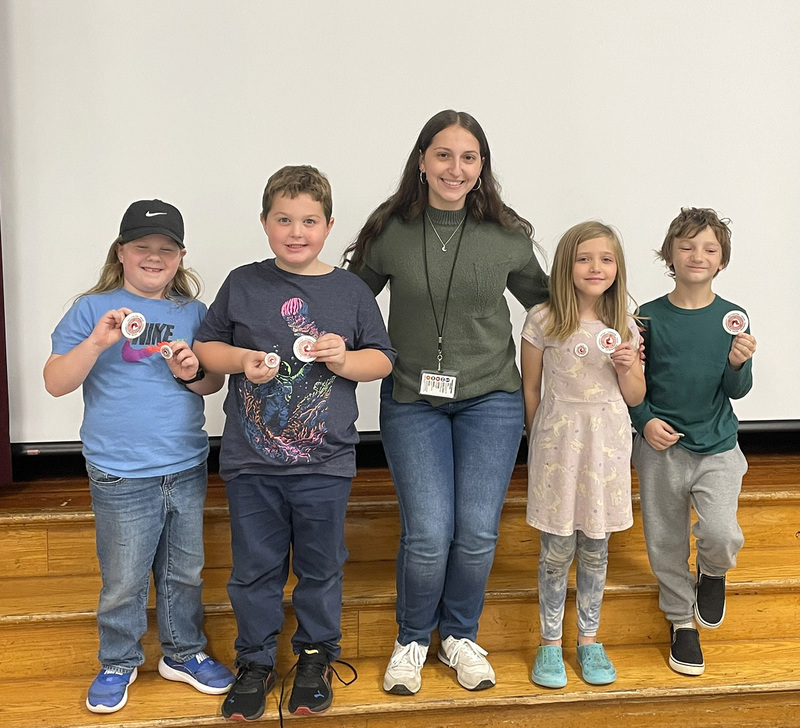 Caryl Adams second and third graders with a SUNY Cortland student majoring in Physical Education.