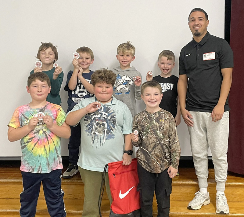 Six Caryl Adams students with a SUNY Cortland student majoring in Physical Education who guided them through six weeks of learning various sports.