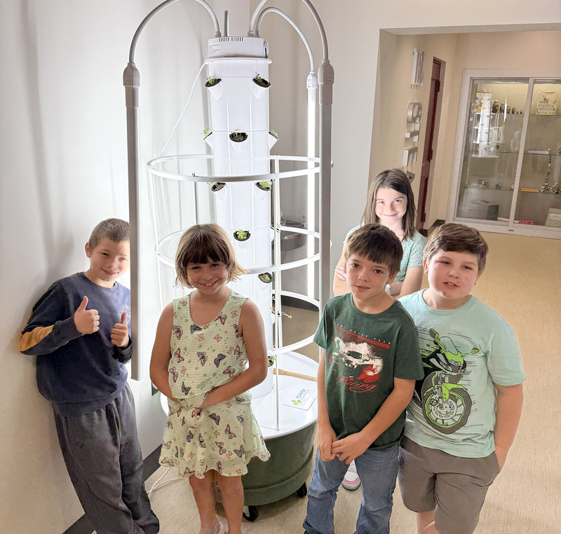 Fourth graders by the grow tower.