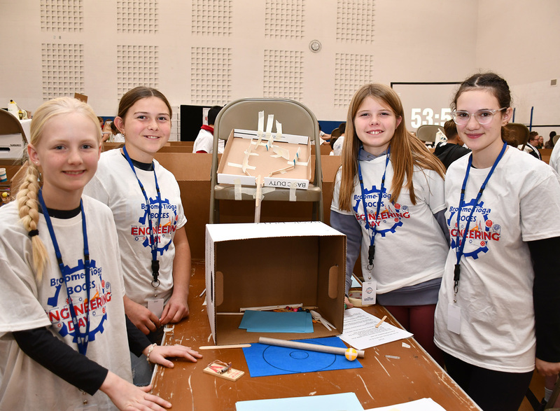 A T R A team of four students in grades six through eight stand around their Rube Goldberg creation for the Middle School Engineering Day at Broome-Tioga BOCES on November 19, 2025.