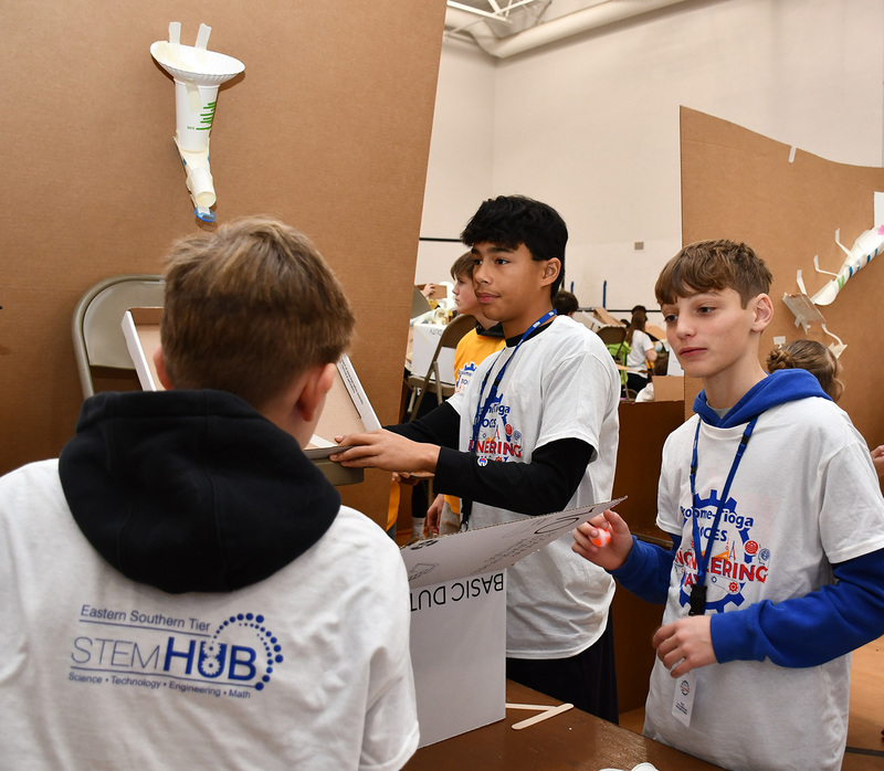 More Tioughnioga Riverside Academy students in grades 6 through 8 work together to build their machine for the engineering day competition.