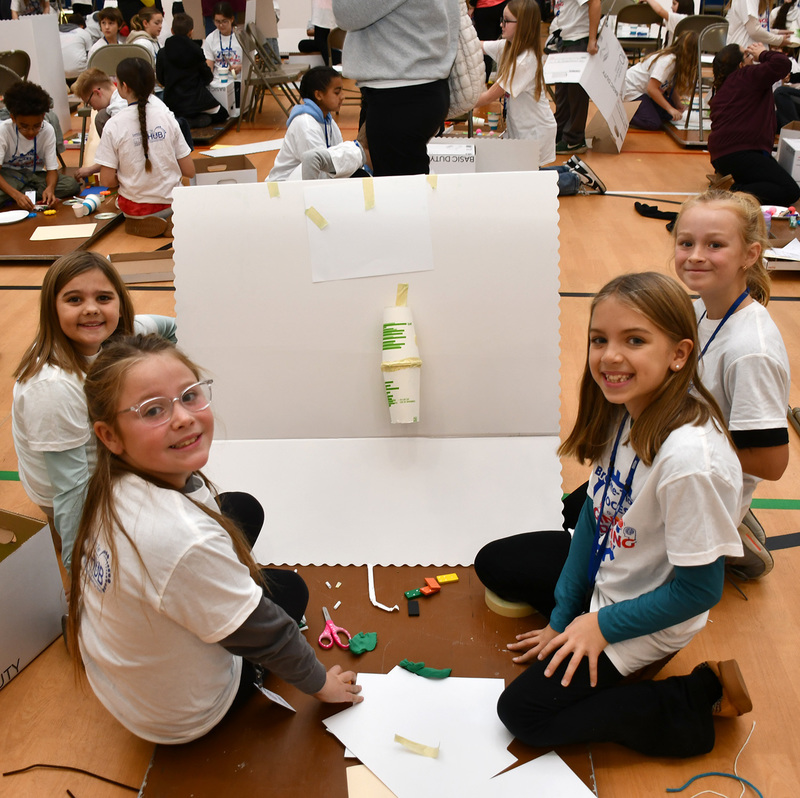 A final team of T R A students in grades 3 through 4 with the start of their Rube Goldberg machine.