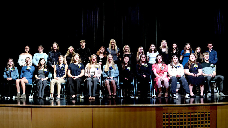 Whitney Point High School National Honor Society members, both current and inductees, on stage in the auditorium on the night of the 2025-26 Induction.