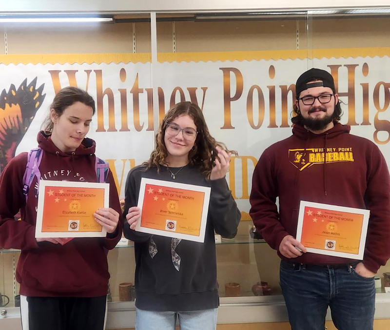 Elizabeth Kiehle, River Schmeiske, and Jason Mathis with their Student of the Month certificates.