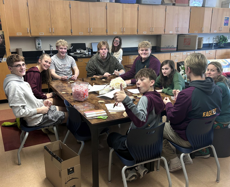 Students on the Whitney Point High School Student Voice committee make candy canes for the positive messages fellow students can share with peers.