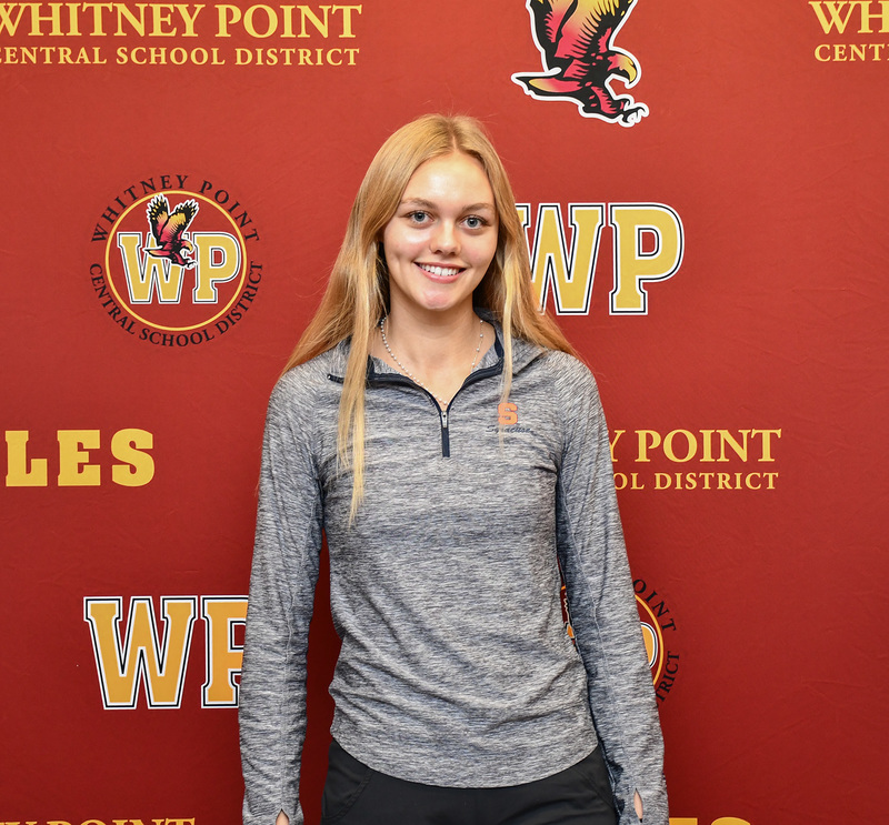Genevieve Huston wearing a Syracuse University half-zip before she signs her national letter of intent.
