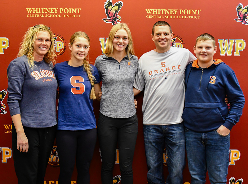 Genevieve Huston with her parents, sister and brother following her signing ceremony in the Whitney Point High School library on December 19, 2025.