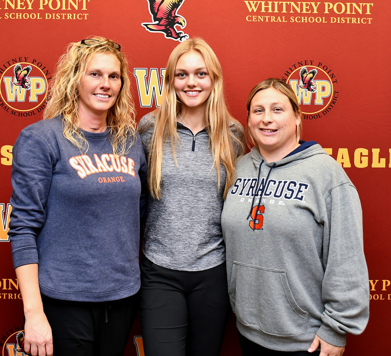 Genevieve with coaches, including head coach and mother, Nicki Huston. 