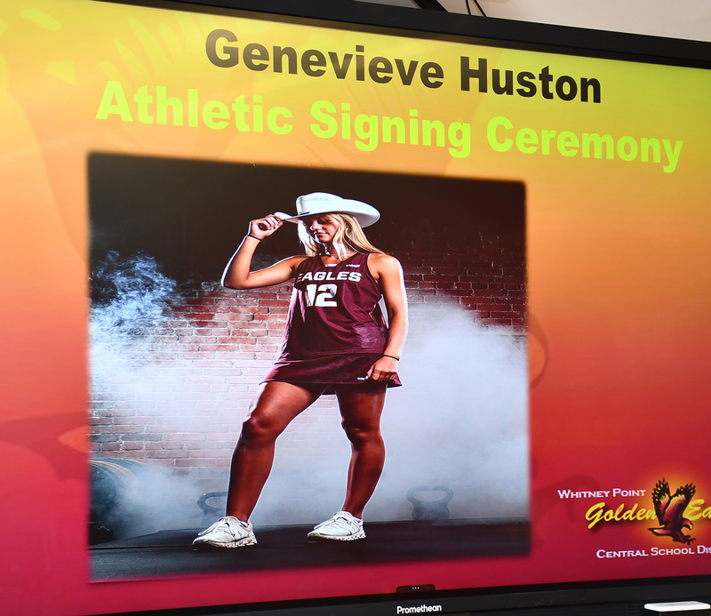 A slide from the presentation shown during Genevieve Huston's signing ceremony showing her in field hockey uniform and cowboy hat.