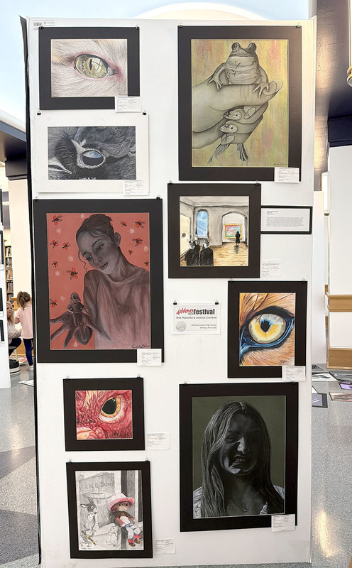 Drawings and paintings by Whitney Point High School students are on a board at the Broome County Public Library as part of the daVinci Visual Arts exhibit.