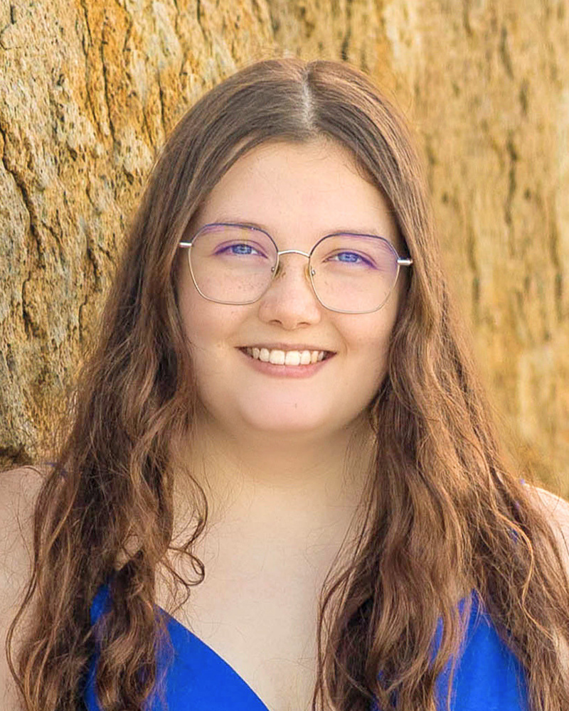 Student of the Month for May 2025 is Shealeigh Sullivan shown here smiling in front of a tree