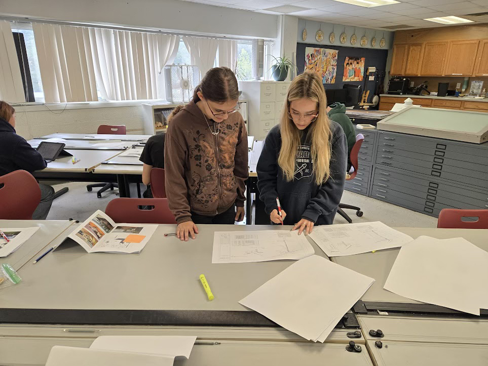 Seniors Reviewing Architecture Plans