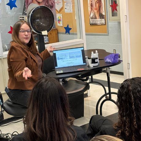 A guest speaker presents to cosmo students