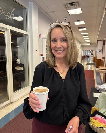 Mrs. Morrison enjoying a cup of coffee.