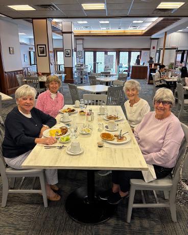 4 smiling women enjoying their Mother's Day Breakfast at Poet's Inn Restaurant.