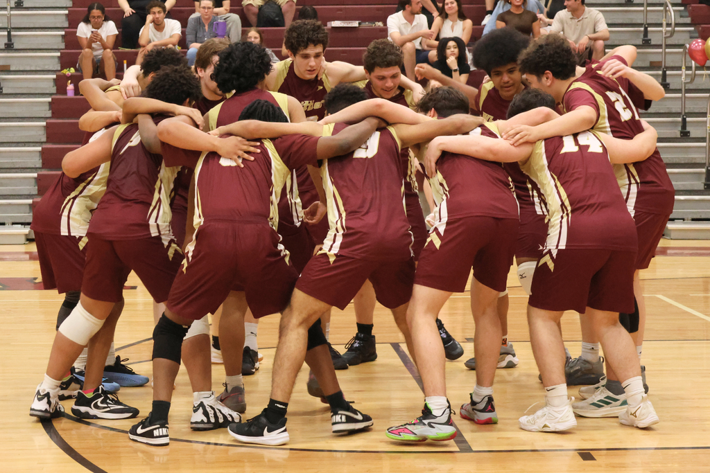 Whittier Tech Boys Volleyball players in their pre-game huddle.