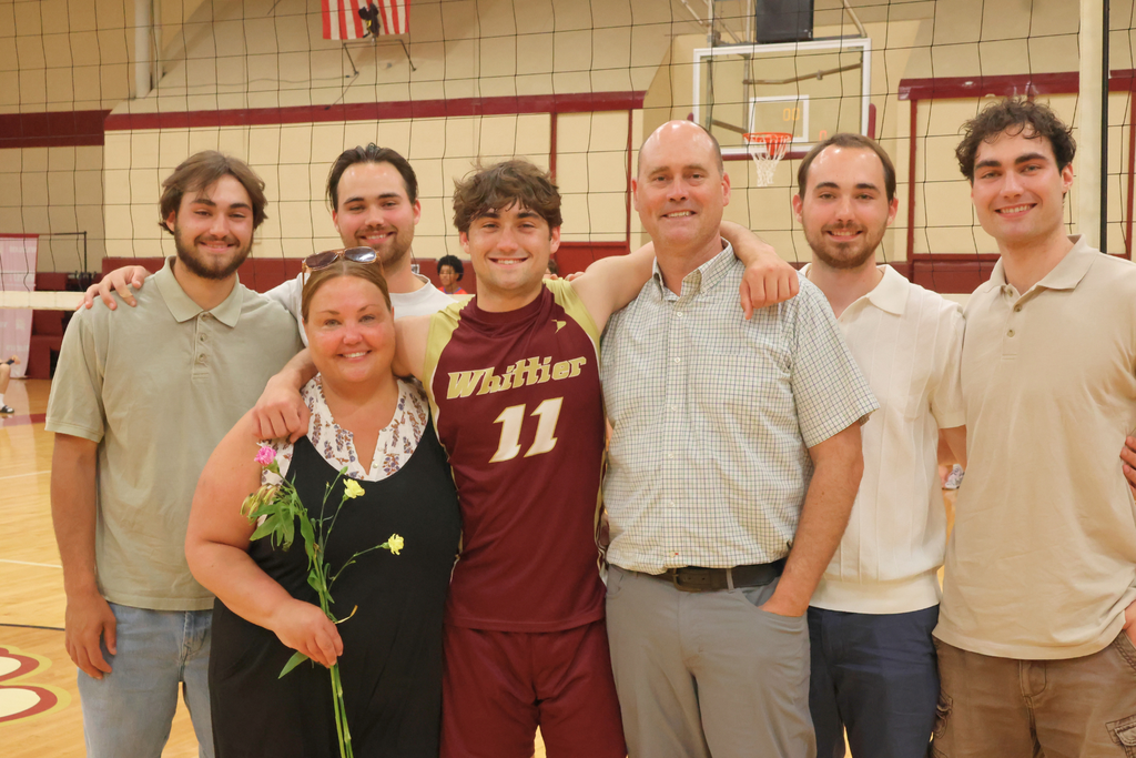 David Mercier, a senior volleyball player smiling with his family.