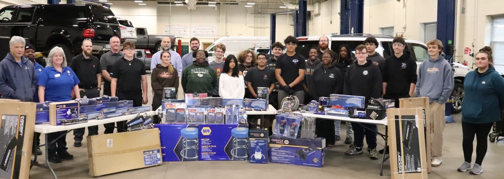 Image of CTE Automotive students receiving $12,000 tool donation from our friends at NAPA Auto