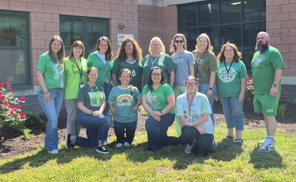 Staff wears green