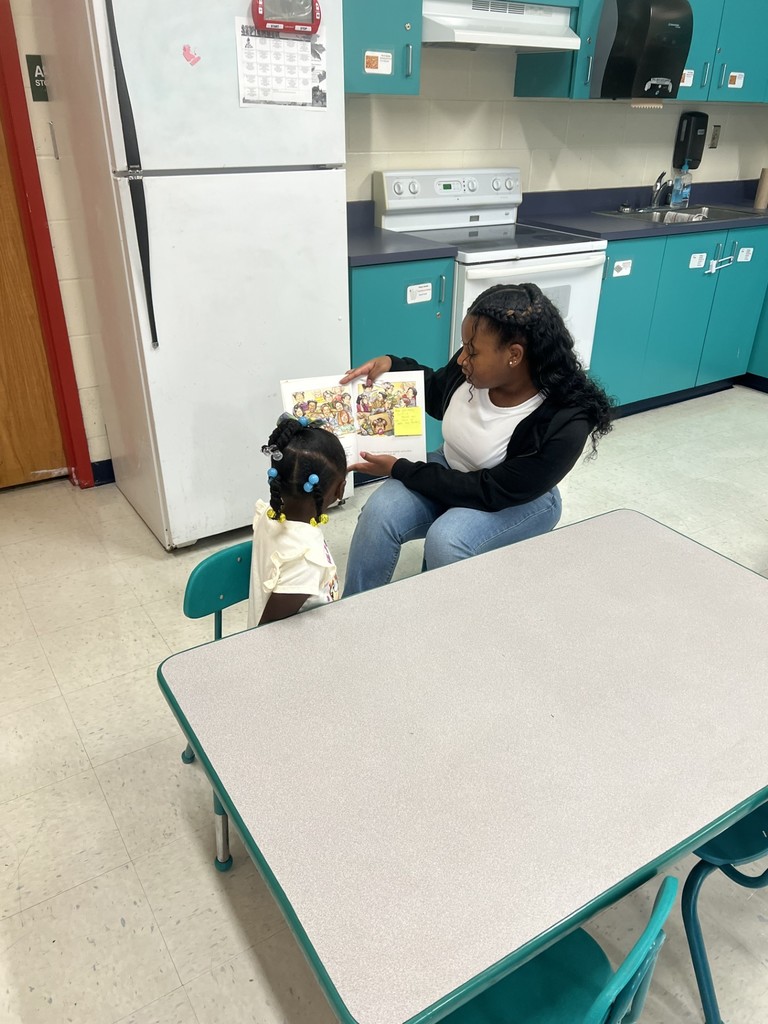 Student working with a child