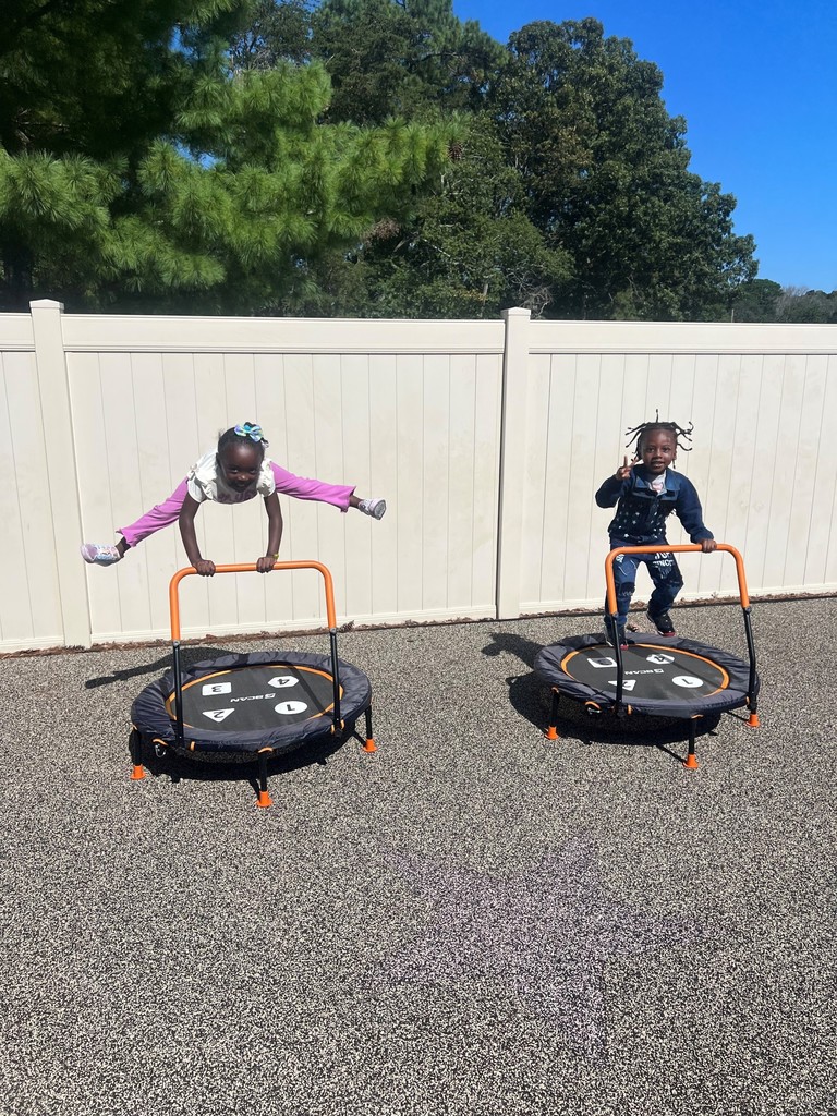 Children playing on outdoor equipment
