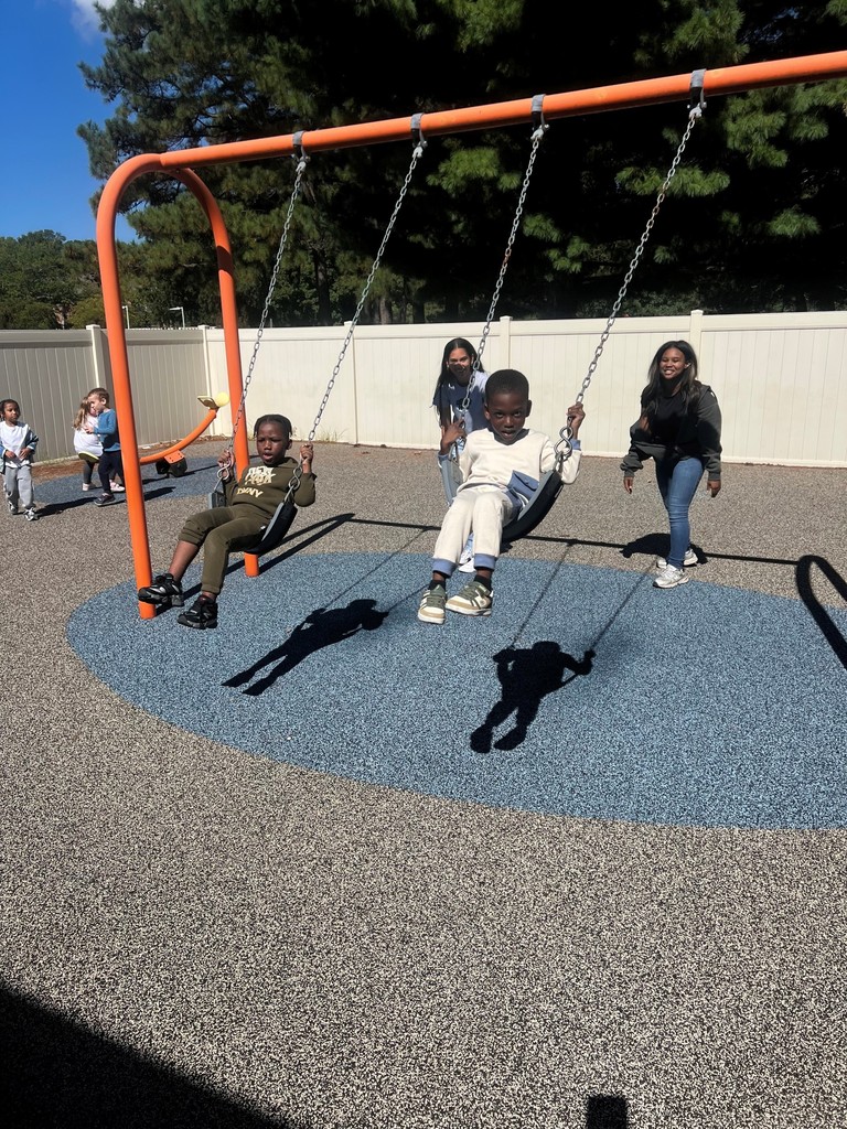 Children playing on outdoor equipment