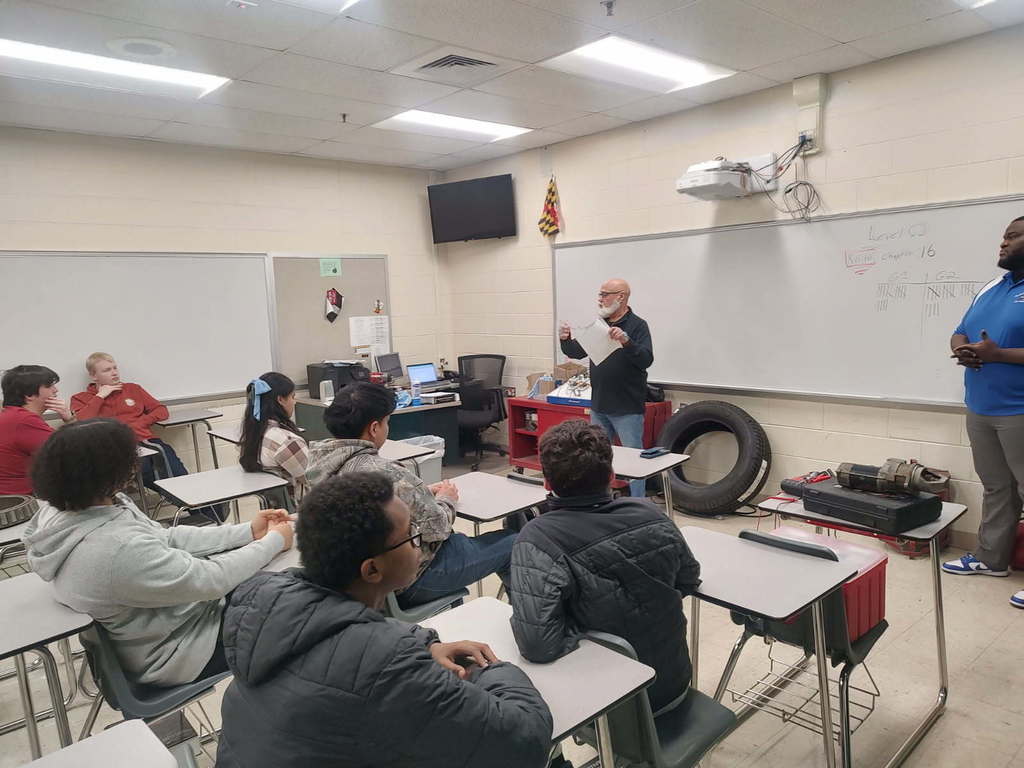 Worwic with students doing a display