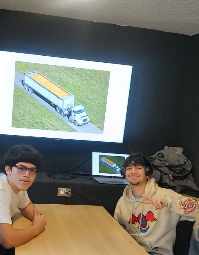 Worwic with students doing a display