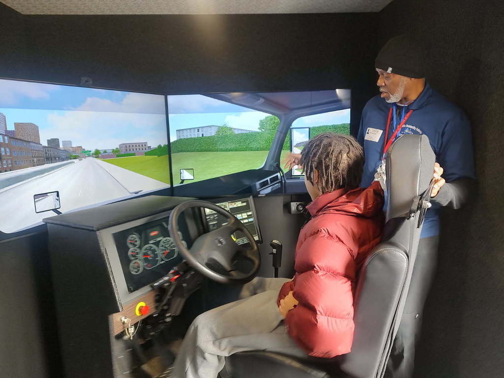 Worwic with students doing a display