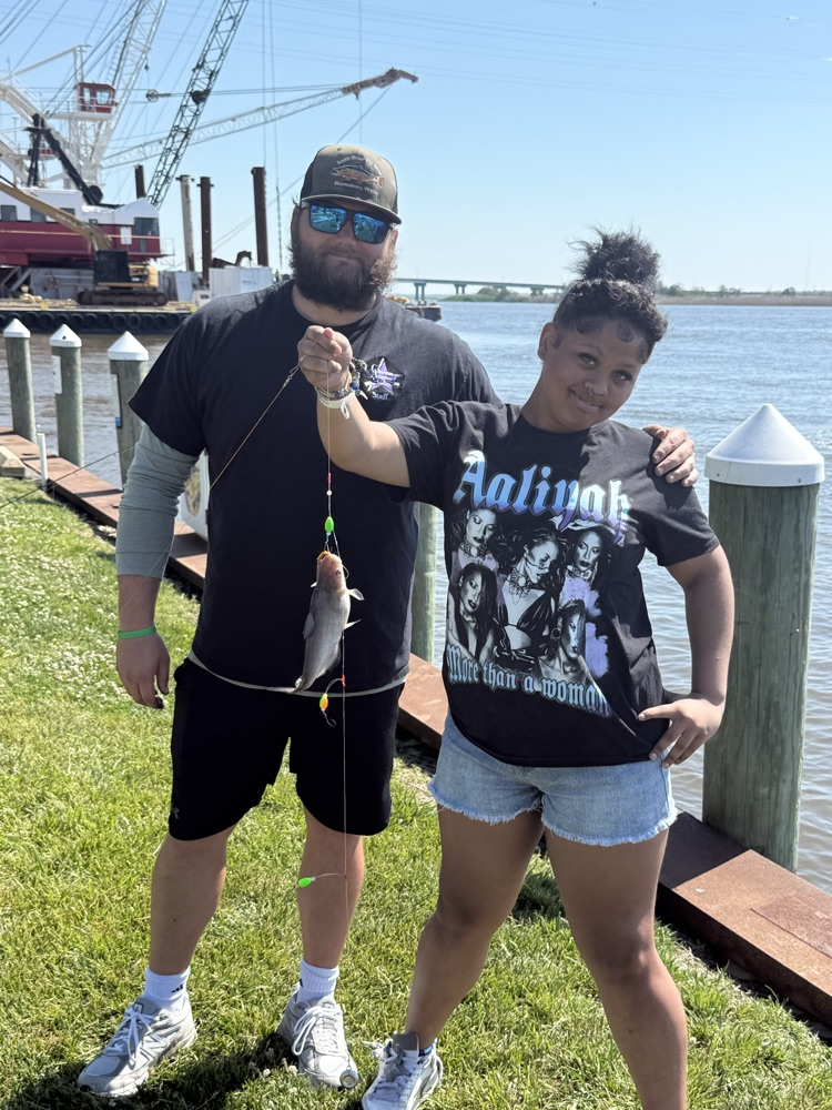 student and teacher fishing 