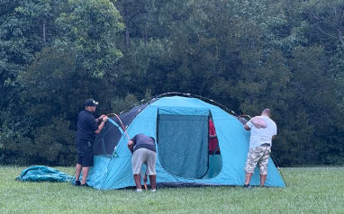 Working together putting up a tent