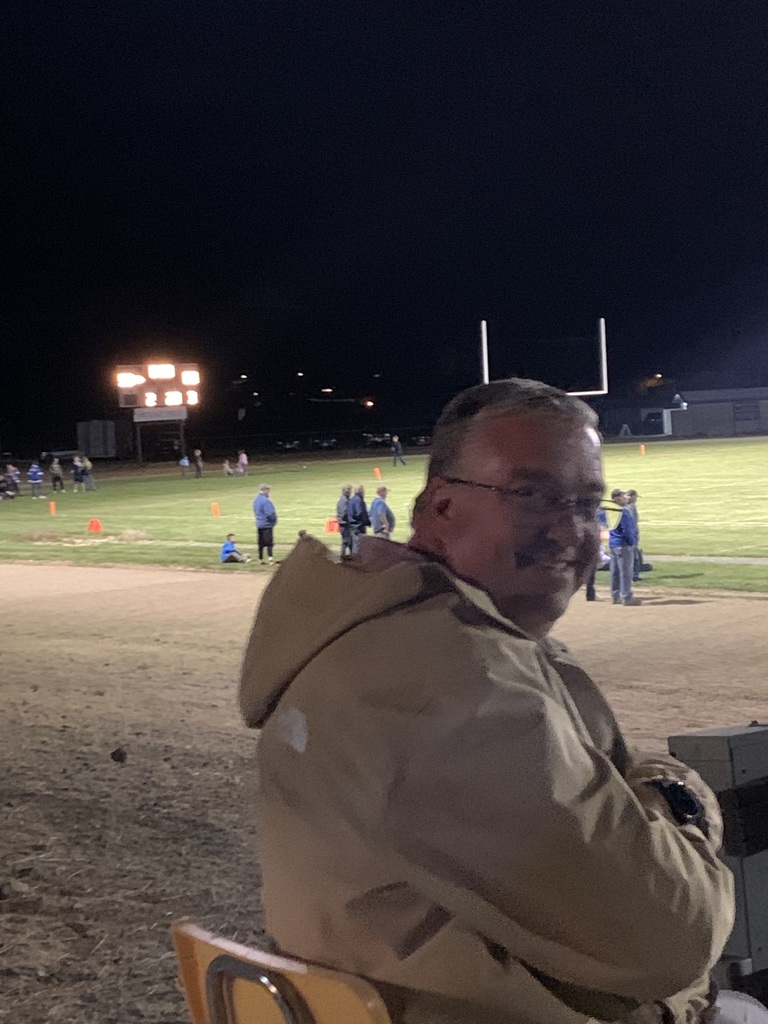 Mr. Arland Running the Football clock