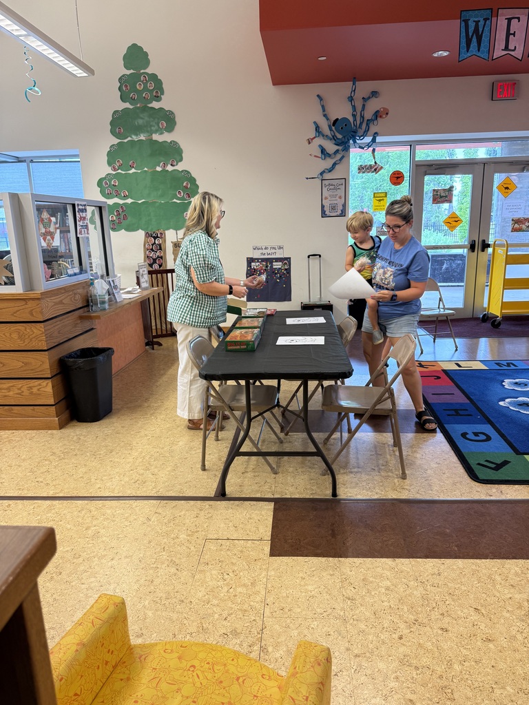 Local LEADS team talking to parents and children at Cabot Public Library
