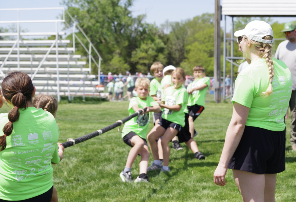 Third graders playing tug of war.