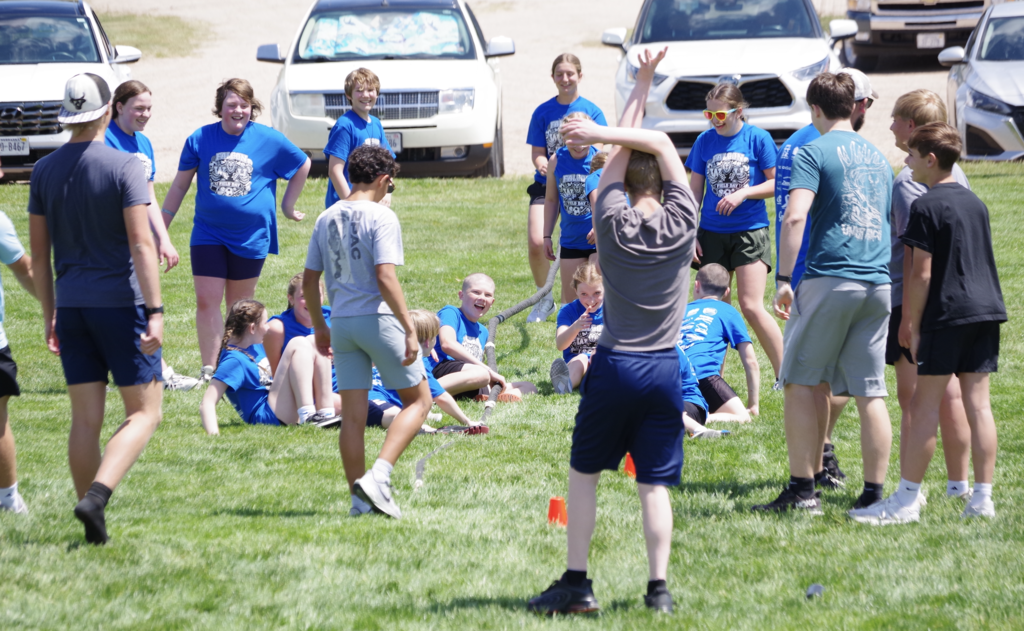 Sixth Grade playing tug of war.