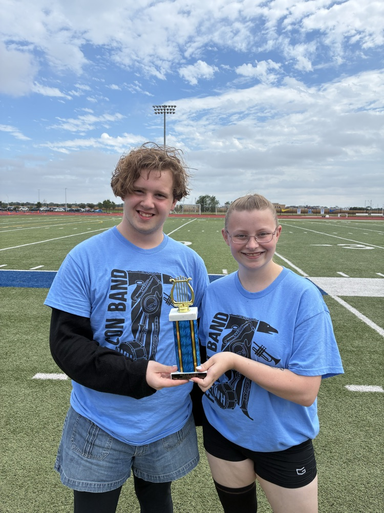 seniors Landin and Tylar accepting the trophy on behalf of the band