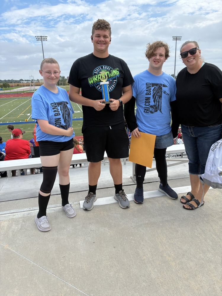 Tylar, Craig, Landin and Mrs. Arehart at the awards ceremony after receiving the trophy