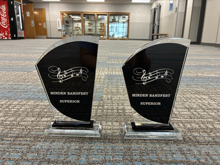 two Superior Trophies awarded to JH and HS band for their performances at Minden band fest  
