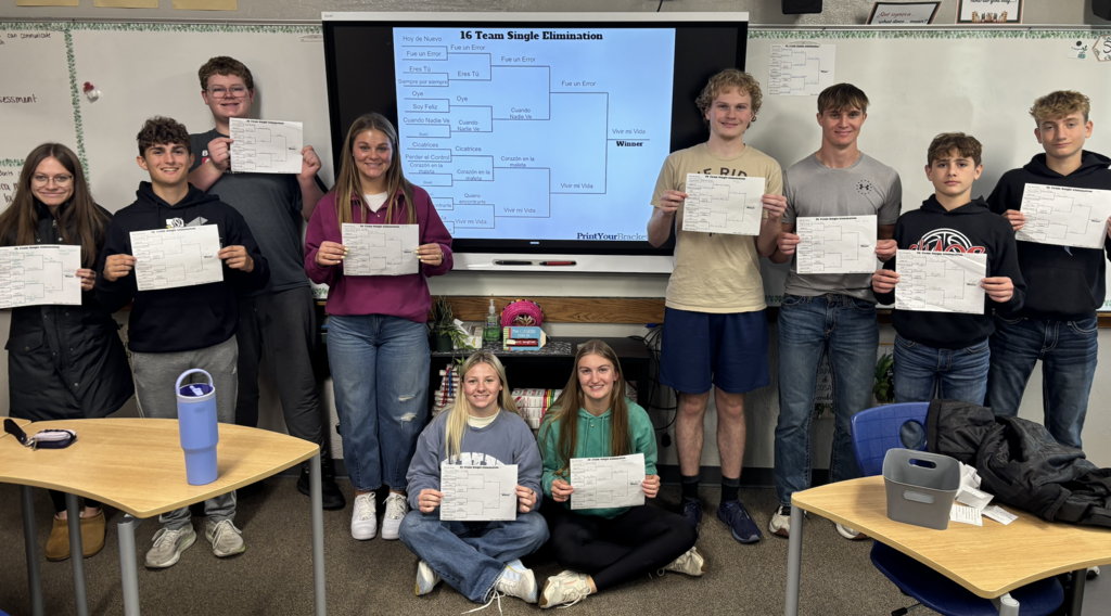 Taylor, Alex, Jadon, Kinley, Elin, Allegra, Keegan, Kaden, Stetson, Rylan with their bracket predictions and the final bracket behind them