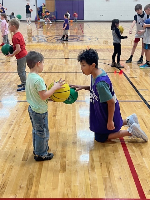 boys basketball team teaches CLC