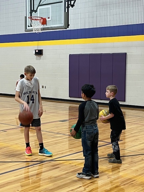 boys basketball team teaches CLC