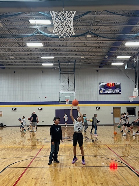 boys basketball team teaches CLC