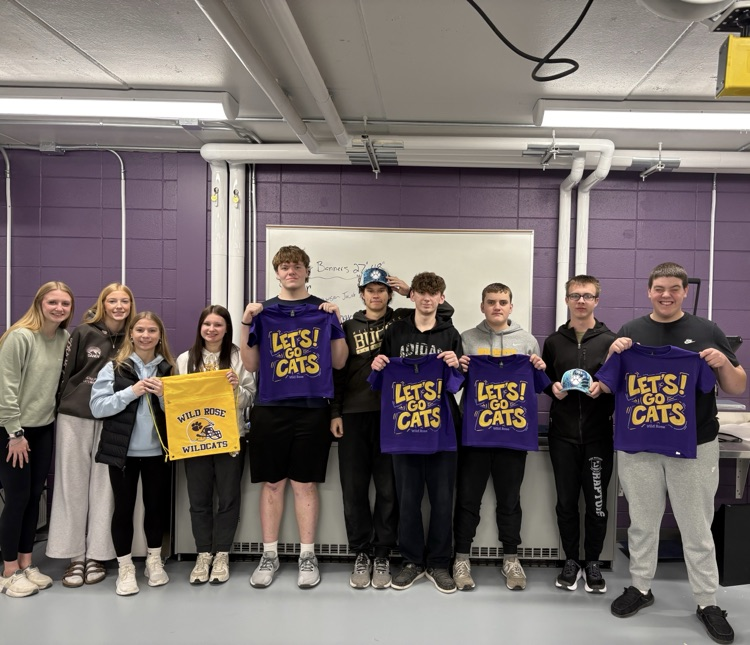 Students in the Wildcat Products class work on screen-printed shirts