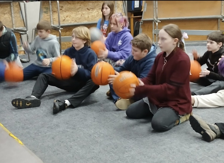 using basketballs to learn rhythm in music class