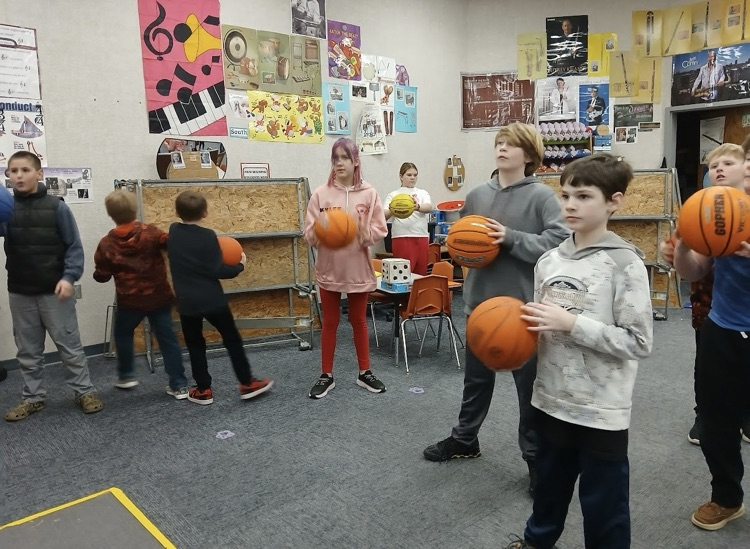 using basketballs to learn rhythm in music class