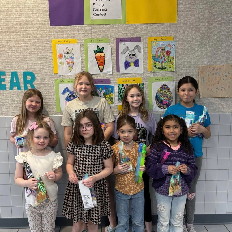 coloring contest winners hold ribbons 