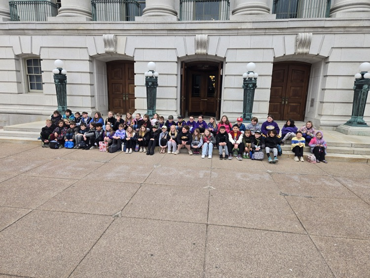 Fourth graders pose outside the capitol in Madison, WI
