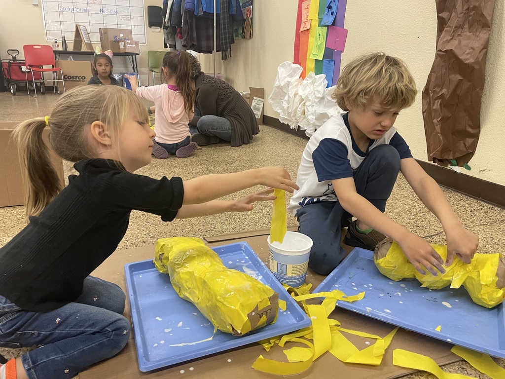 Two of our younger students hard at work on their endangered species puppets!